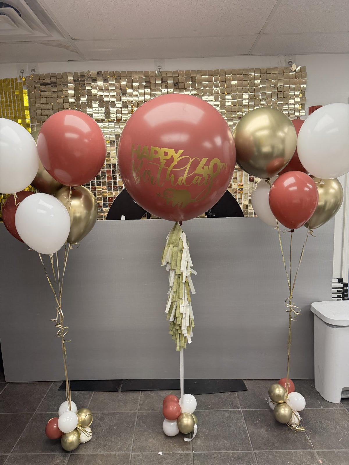 Jumbo helium balloon with tassel and helium balloon bundles by Balloons & Beyond HTX in Houston